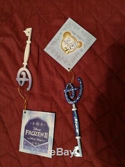 2 Disney store Keys Cindarella and Elsa Snowqueen