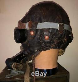 WW2. A RAF flying helmet and cockpit instruments. Former owner Murray Valantine