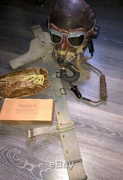 WW2. A RAF flying helmet and cockpit instruments. Former owner Murray Valantine